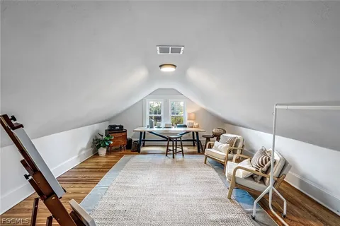 a swimming pool with yard outdoor seating and yard in the back