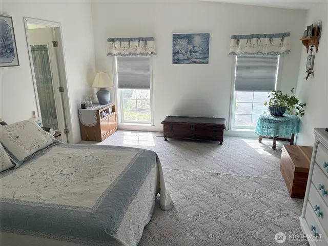 a bedroom with a bed and a couch