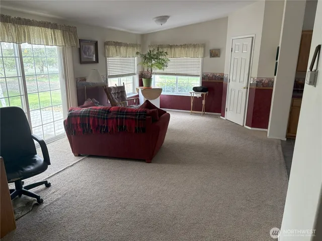 a living room with furniture and a window