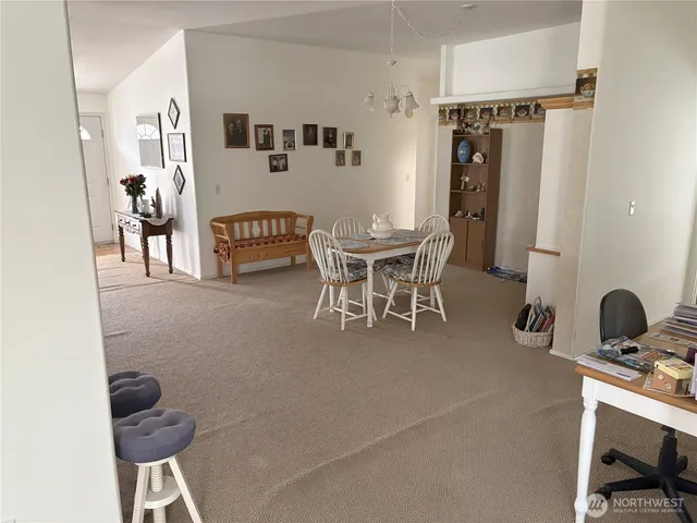 a view of a livingroom with furniture and windows