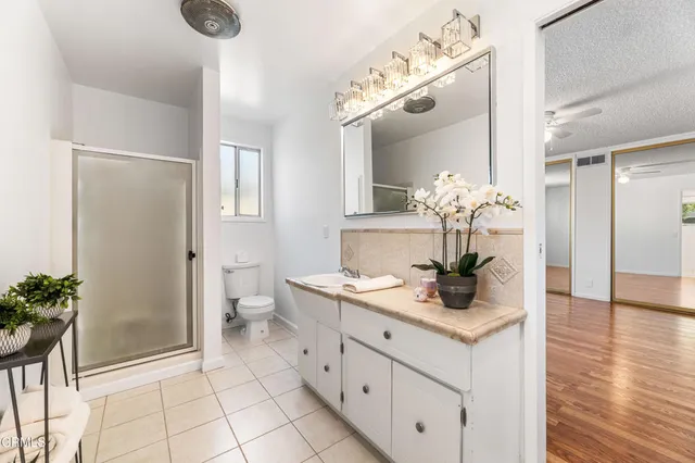 a bedroom with a bed and a couch