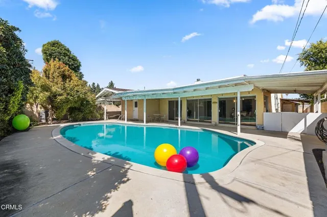 a kitchen with stainless steel appliances granite countertop a stove and a refrigerator