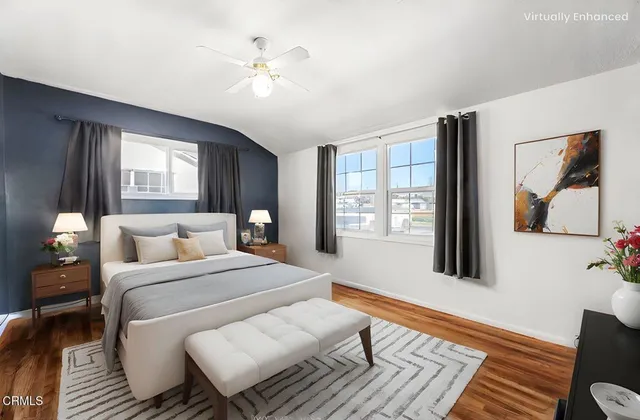 a bathroom with a granite countertop sink a toilet and a mirror