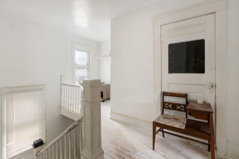 210 North Main Street Tampico, IL 61283 - Photo 8 of 10 a view of a hallway with seating area