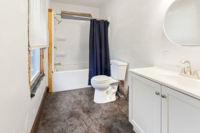 210 North Main Street Tampico, IL 61283 - Photo 10 of 10 a bathroom with a sink toilet and shower