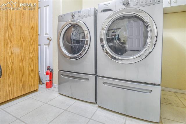 4765 South Johnson Road Rush, CO 80833 - Photo 22 of 36 Laundry/mudroom and washer/dryer is included