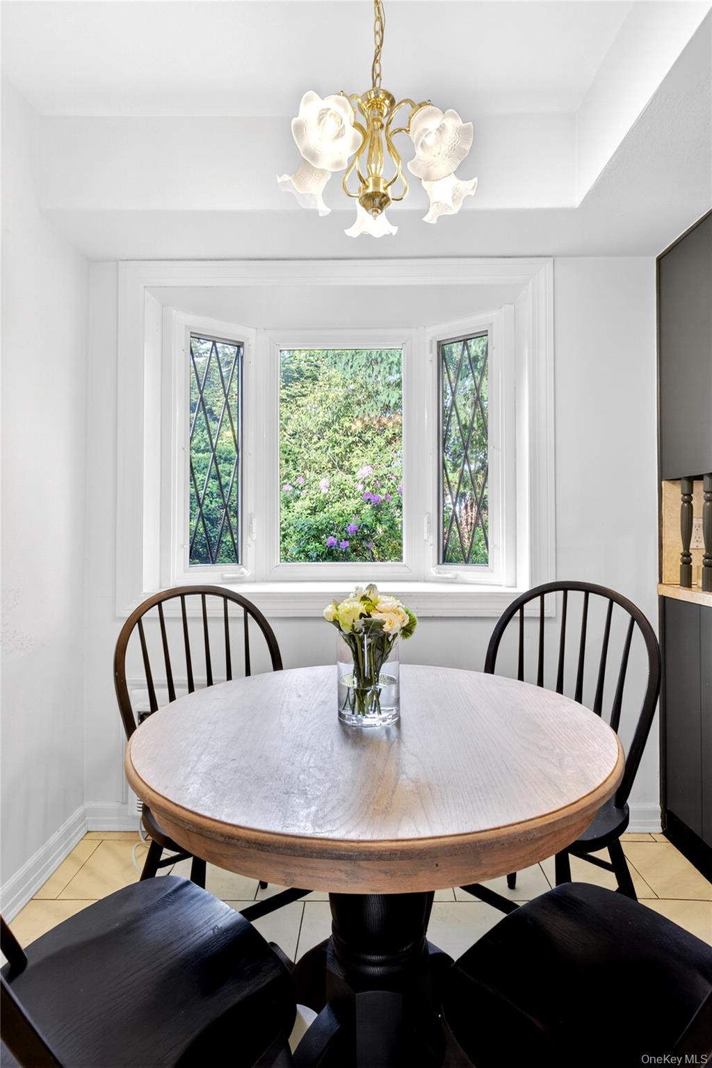 142 Mill Spring Road Manhasset, NY 11030 - Photo 12 of 23 a view of a dining room with furniture window and outside view