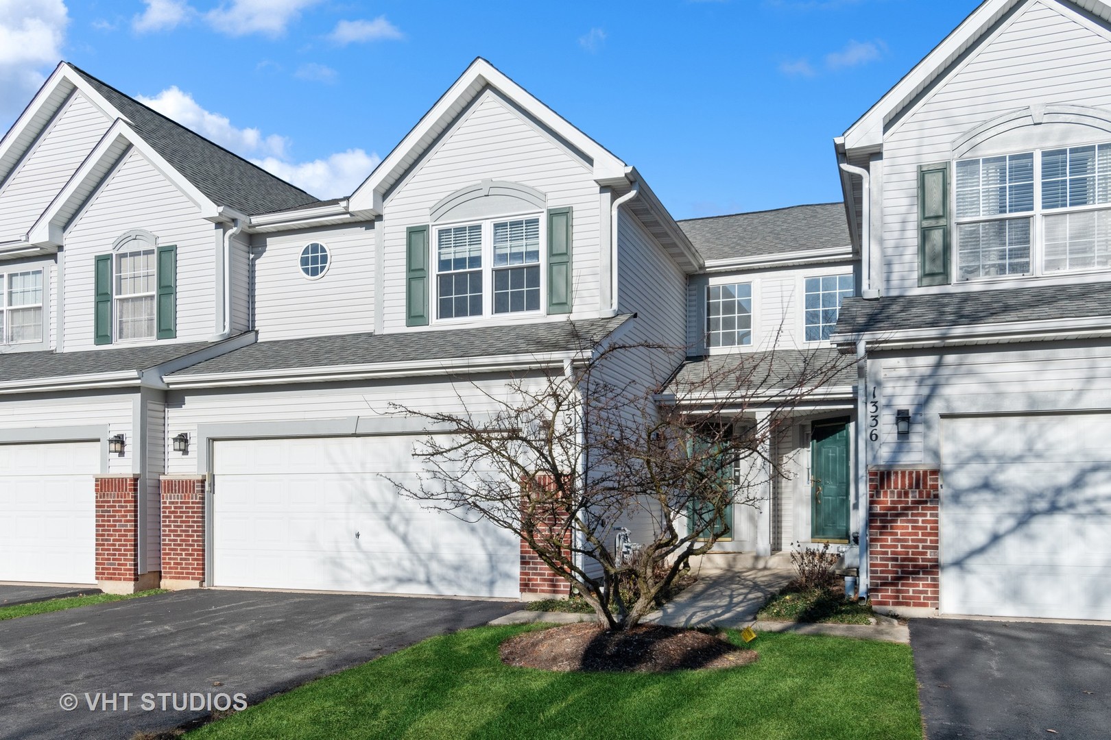 a front view of a house with a yard
