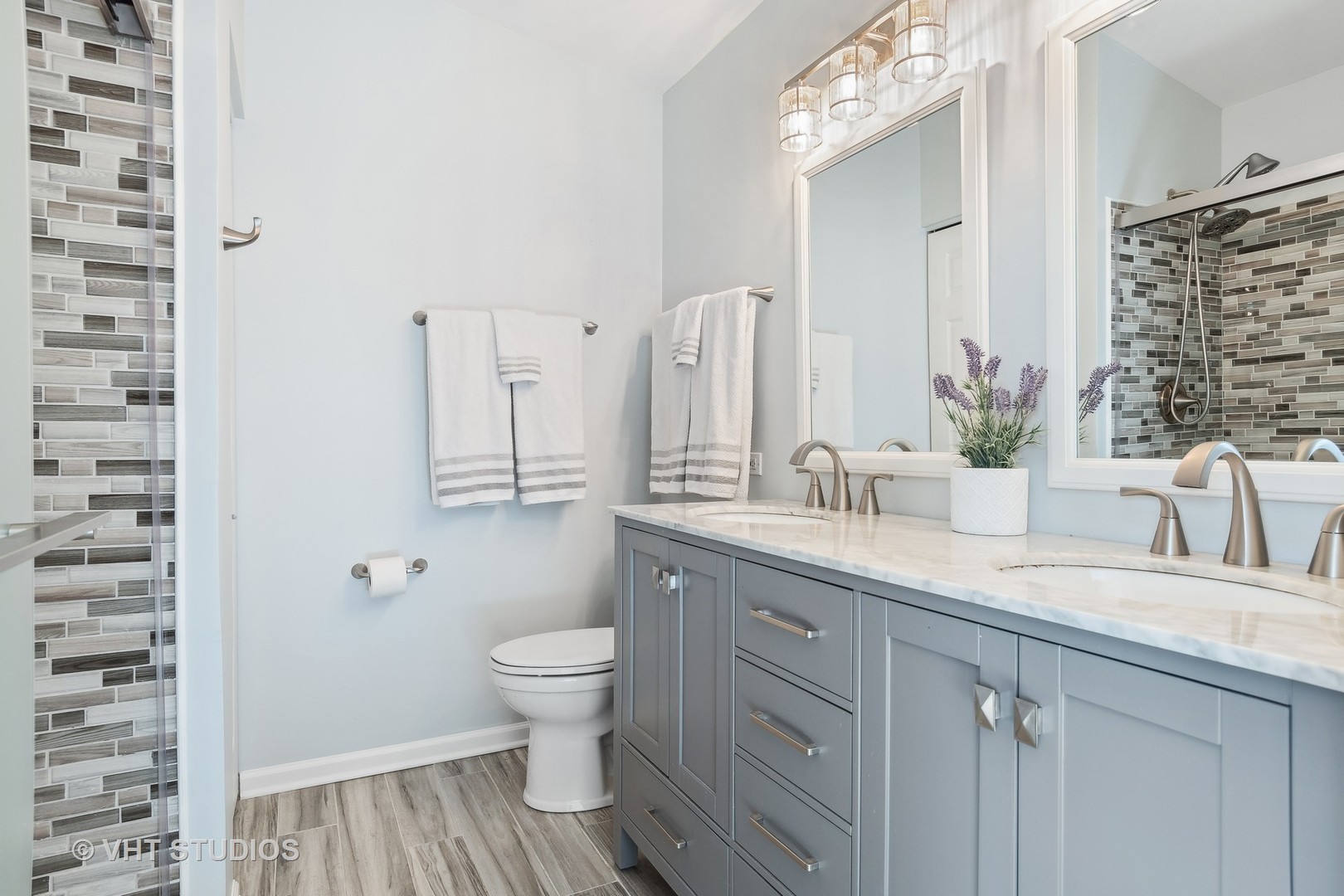 1338 Filly Lane Bartlett, IL 60103 - Photo 11 of 18 a bathroom with a granite countertop sink toilet and shower