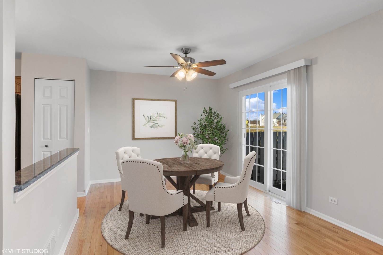 1338 Filly Lane Bartlett, IL 60103 - Photo 4 of 18 a dining room with furniture a chandelier and wooden floor