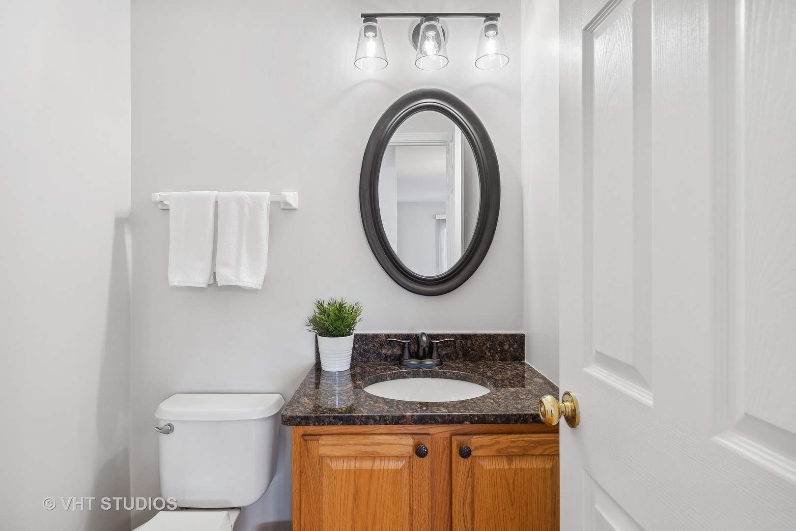 1338 Filly Lane Bartlett, IL 60103 - Photo 8 of 18 a bathroom with a granite countertop sink and a mirror