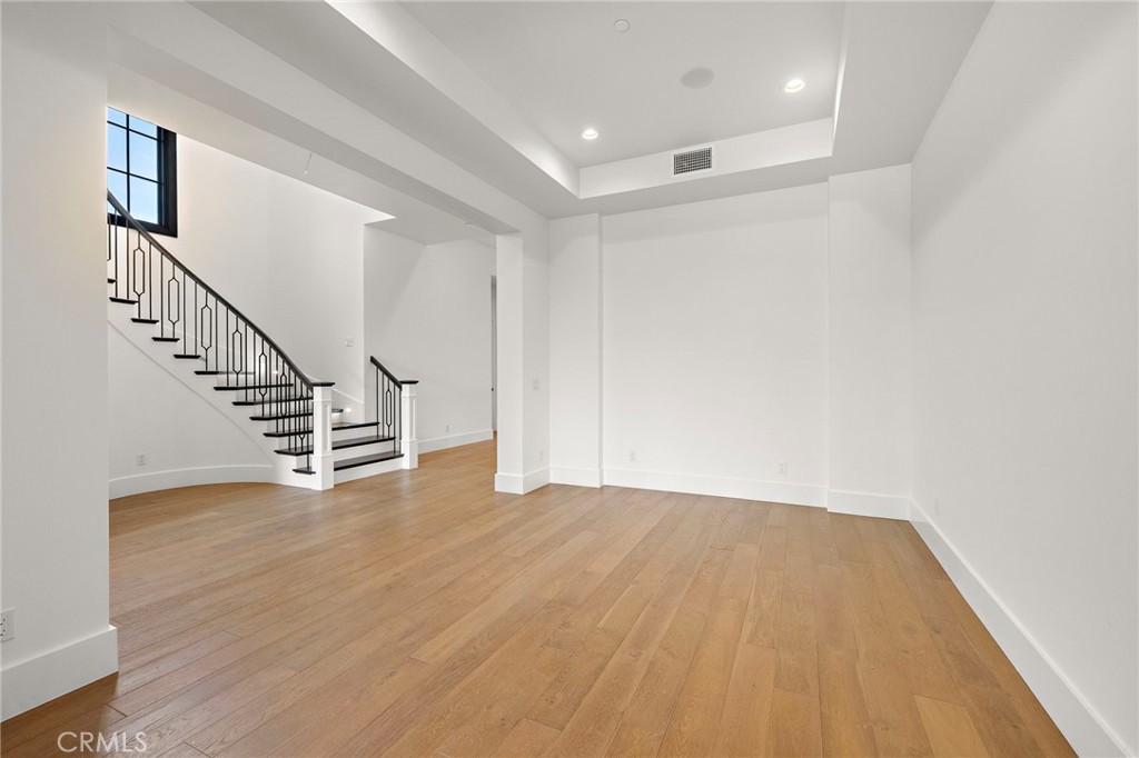7 Alexa Lane Ladera Ranch, CA 92694 - Photo 14 of 75 a view of an empty room with wooden floor and stairs