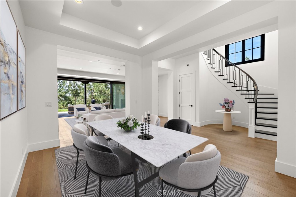 7 Alexa Lane Ladera Ranch, CA 92694 - Photo 18 of 75 a view of a dining room with furniture window and wooden floor