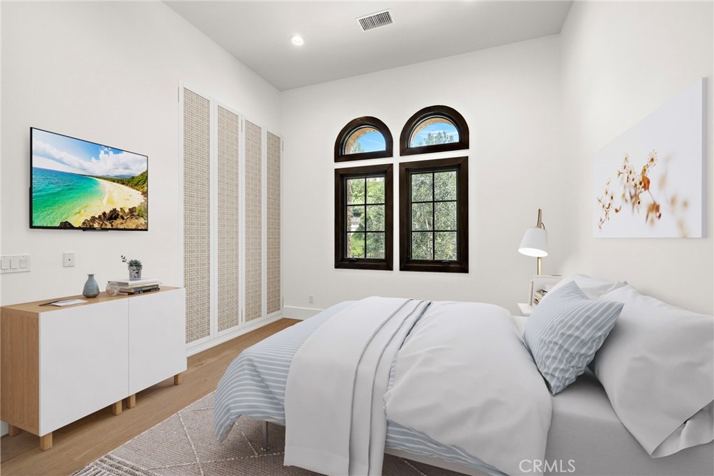 7 Alexa Lane Ladera Ranch, CA 92694 - Photo 20 of 75 a bedroom with a bed and a flat screen tv
