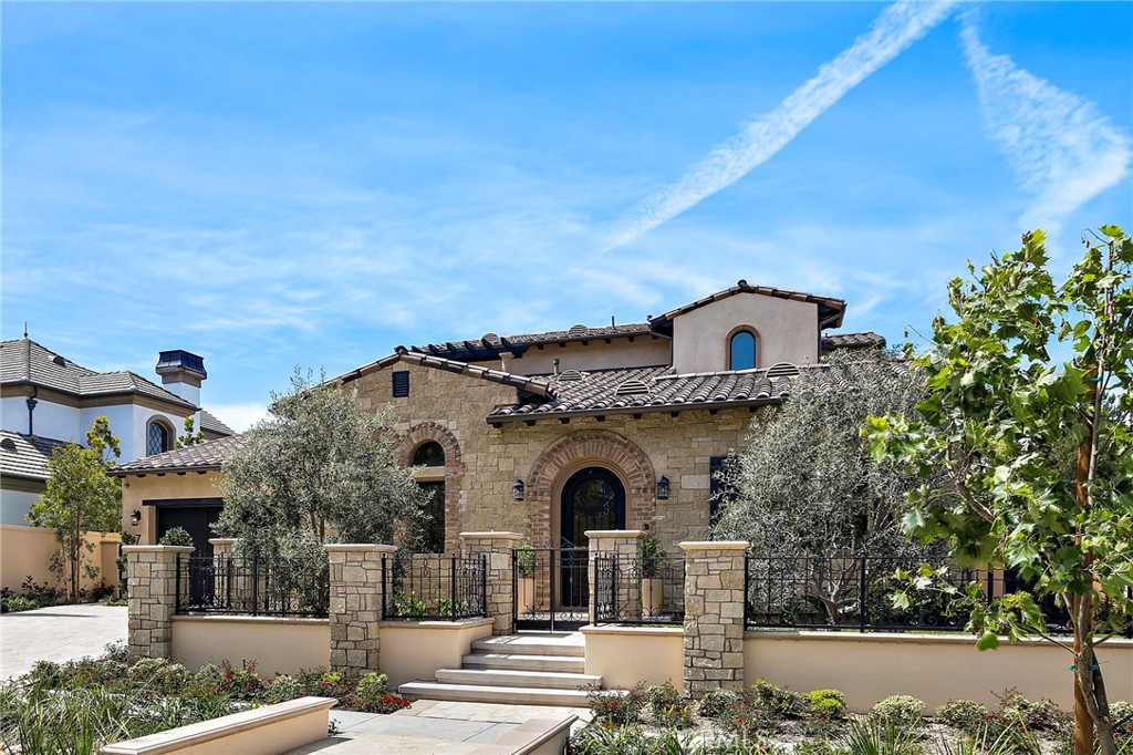 7 Alexa Lane Ladera Ranch, CA 92694 - Photo 2 of 75 a front view of a house with a garden