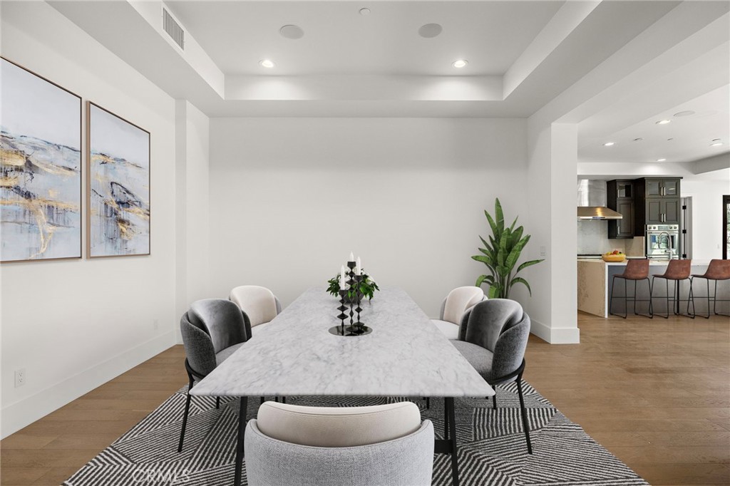 7 Alexa Lane Ladera Ranch, CA 92694 - Photo 21 of 75 a dining room with furniture and wooden floor