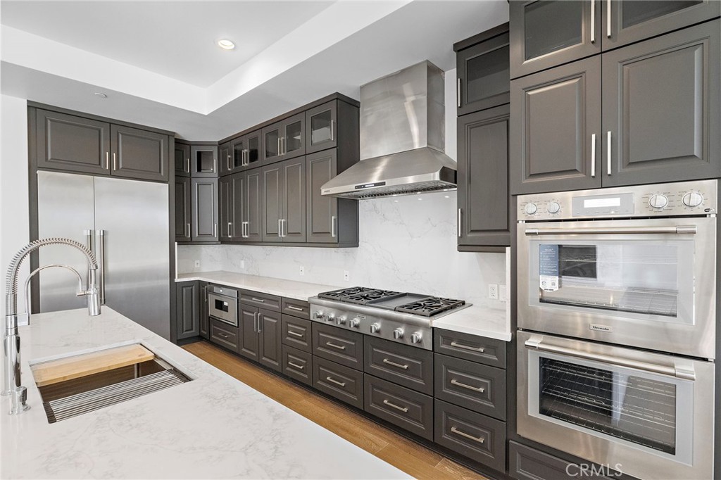 7 Alexa Lane Ladera Ranch, CA 92694 - Photo 24 of 75 a kitchen with stainless steel appliances granite countertop a stove and a refrigerator
