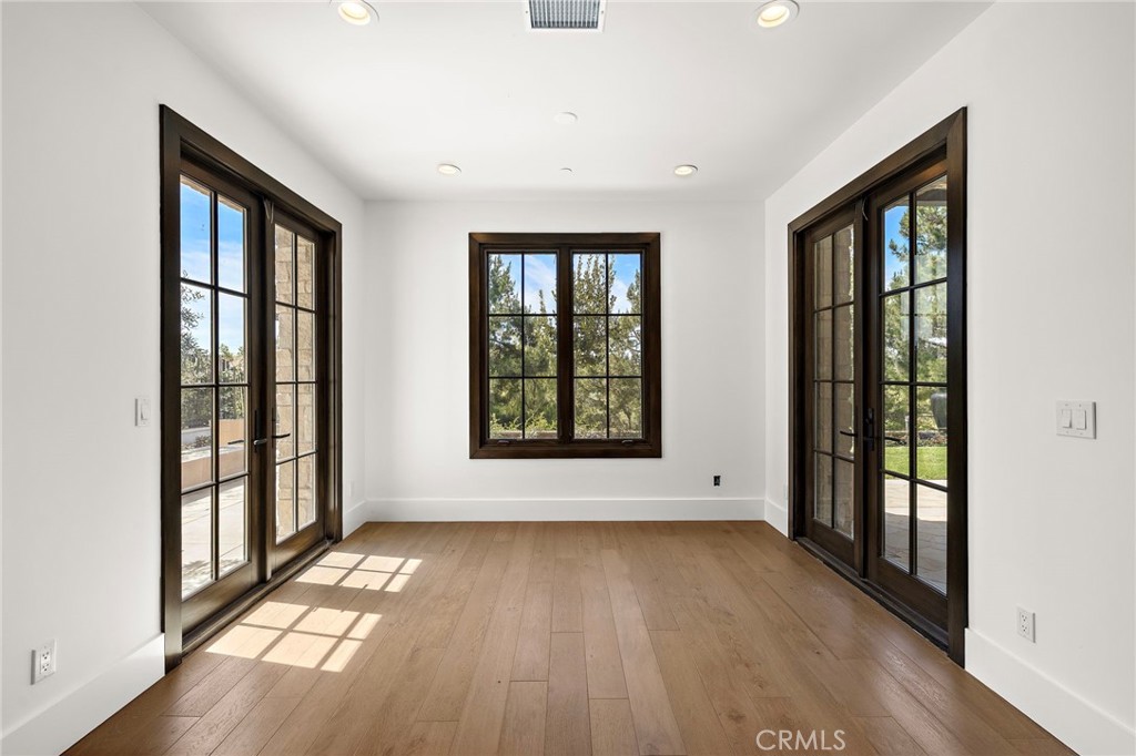 7 Alexa Lane Ladera Ranch, CA 92694 - Photo 31 of 75 wooden floor in an empty room with a window
