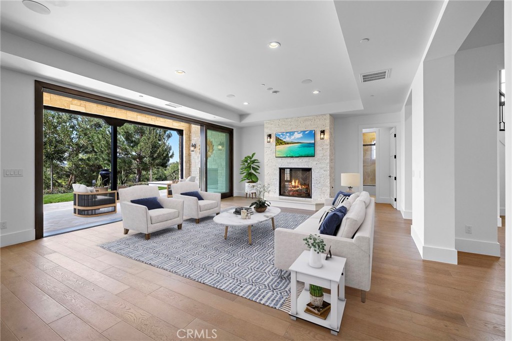 7 Alexa Lane Ladera Ranch, CA 92694 - Photo 41 of 75 a living room with furniture and a large window