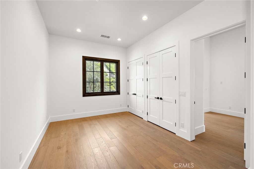 7 Alexa Lane Ladera Ranch, CA 92694 - Photo 46 of 75 an empty room with wooden floor and windows