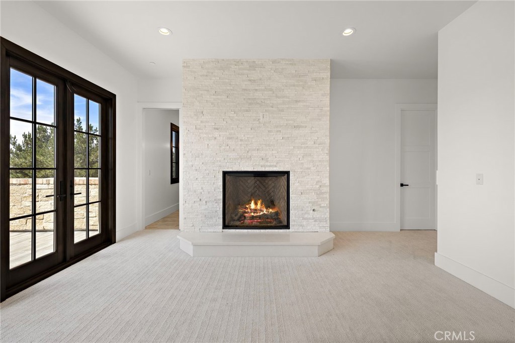 7 Alexa Lane Ladera Ranch, CA 92694 - Photo 54 of 75 a view of an empty room with a fireplace and a window