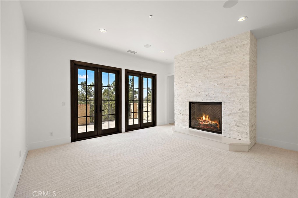 7 Alexa Lane Ladera Ranch, CA 92694 - Photo 57 of 75 a view of an empty room with a fireplace and a window