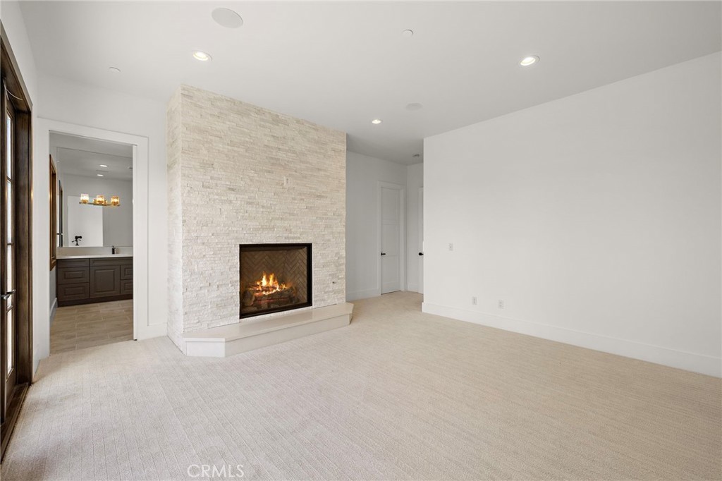 7 Alexa Lane Ladera Ranch, CA 92694 - Photo 60 of 75 an empty room with a fireplace and a fireplace