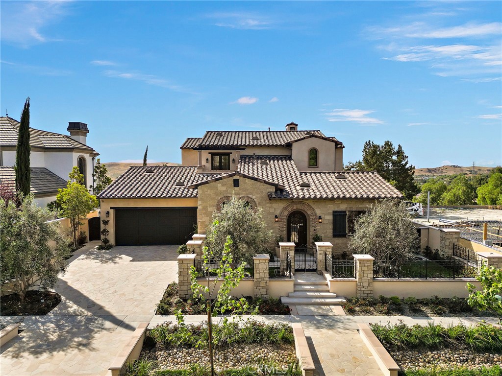 7 Alexa Lane Ladera Ranch, CA 92694 - Photo 6 of 75 a front view of a house with a garden