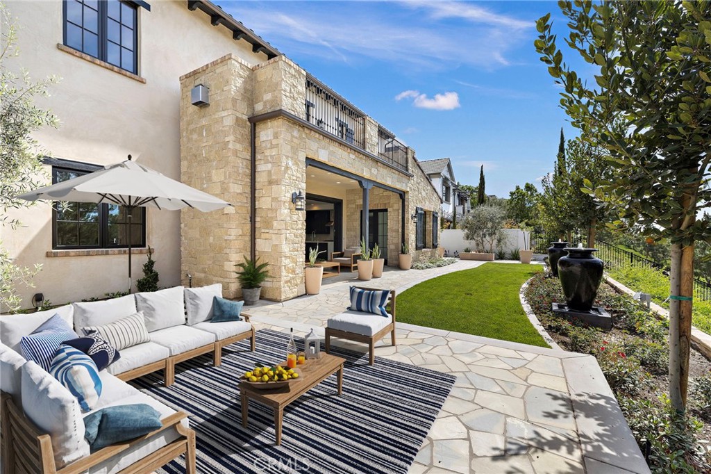 7 Alexa Lane Ladera Ranch, CA 92694 - Photo 65 of 75 a view of a patio with couches and a fire pit