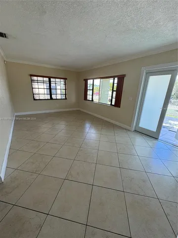 a view of an empty room and window