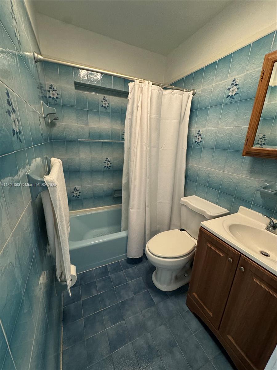 110 West 44th Street, Unit 110 Hialeah, FL 33012 - Photo 6 of 10 a bathroom with a toilet a sink and shower