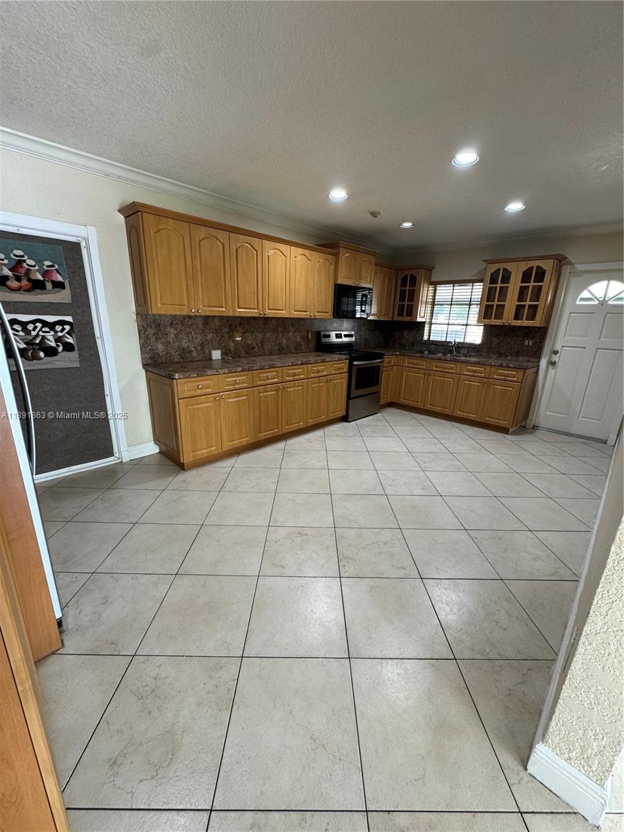 110 West 44th Street, Unit 110 Hialeah, FL 33012 - Photo 9 of 10 a view of kitchen with cabinets