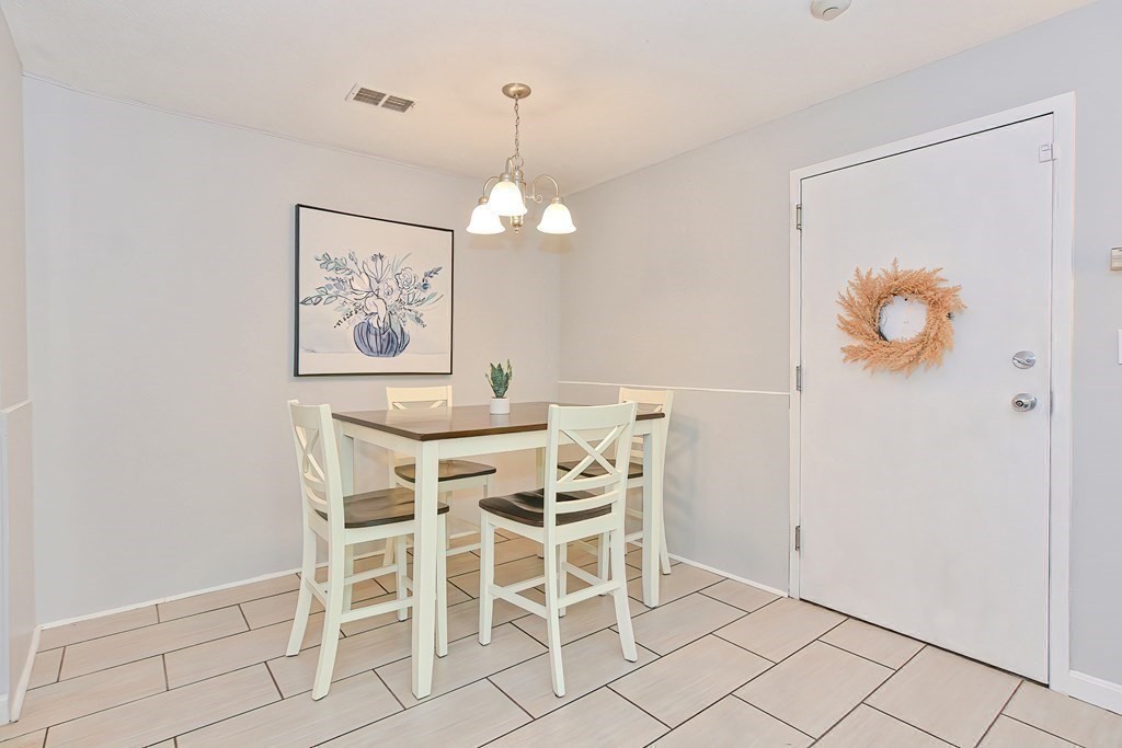 801 Franklin Crossing Road, Unit 801 Franklin, MA 02038 - Photo 2 of 38 a view of a dining room with furniture and wooden floor