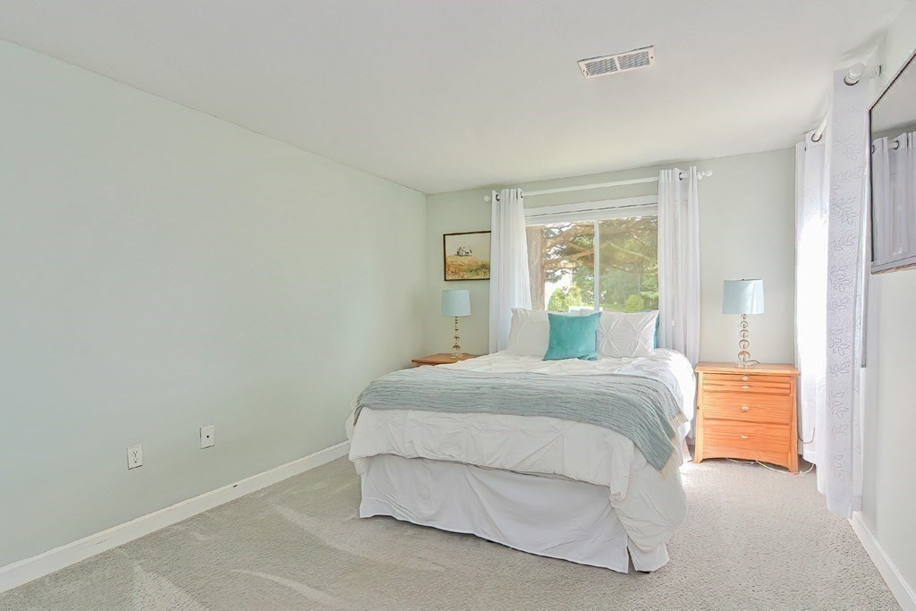 801 Franklin Crossing Road, Unit 801 Franklin, MA 02038 - Photo 21 of 38 a spacious bedroom with a bed and window
