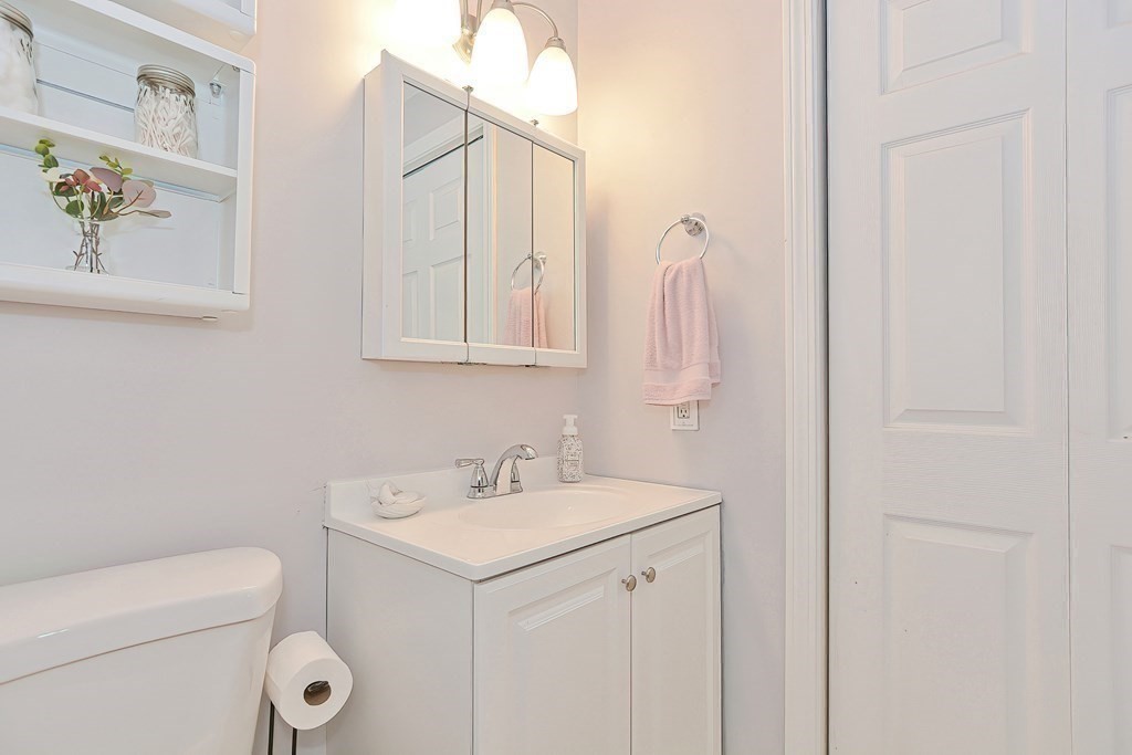 801 Franklin Crossing Road, Unit 801 Franklin, MA 02038 - Photo 23 of 38 a bathroom with a sink a toilet and mirror