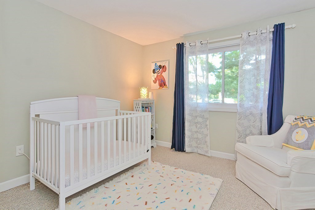 801 Franklin Crossing Road, Unit 801 Franklin, MA 02038 - Photo 24 of 38 a bedroom with furniture and a window