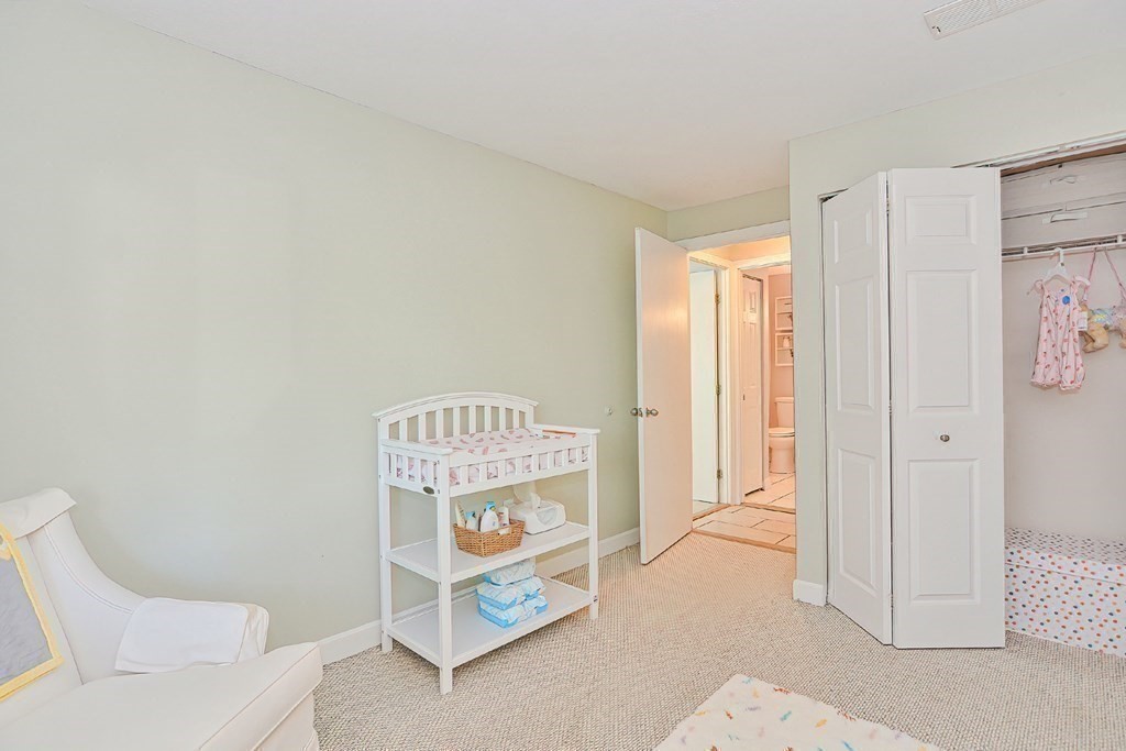 801 Franklin Crossing Road, Unit 801 Franklin, MA 02038 - Photo 26 of 38 a room with a bed and a window
