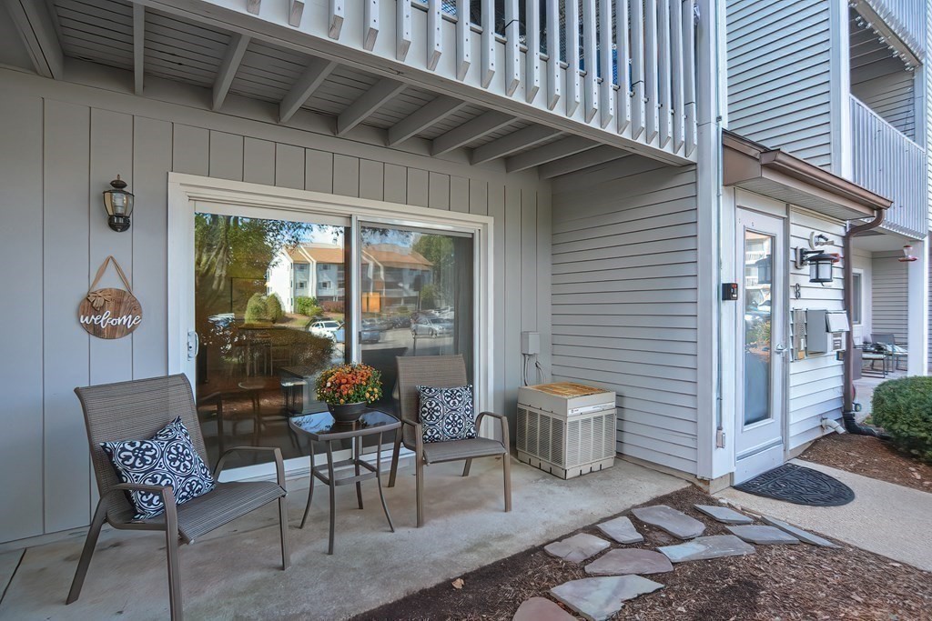 801 Franklin Crossing Road, Unit 801 Franklin, MA 02038 - Photo 29 of 38 a outdoor space with a couch and chairs