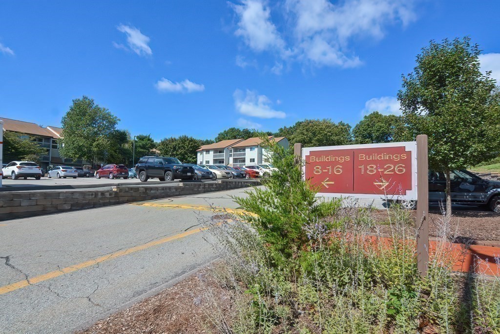 801 Franklin Crossing Road, Unit 801 Franklin, MA 02038 - Photo 30 of 38 a view of city street with a building and trees in the background