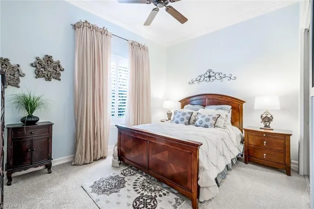 a bedroom with a bed and a potted plant