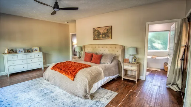 a bedroom with a bed and a dresser