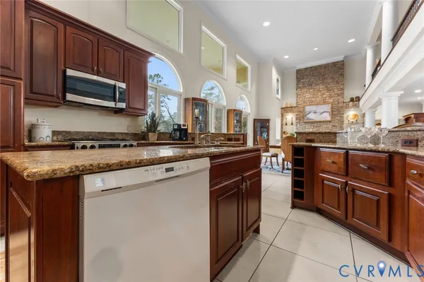 a view of a porch with furniture and a yard