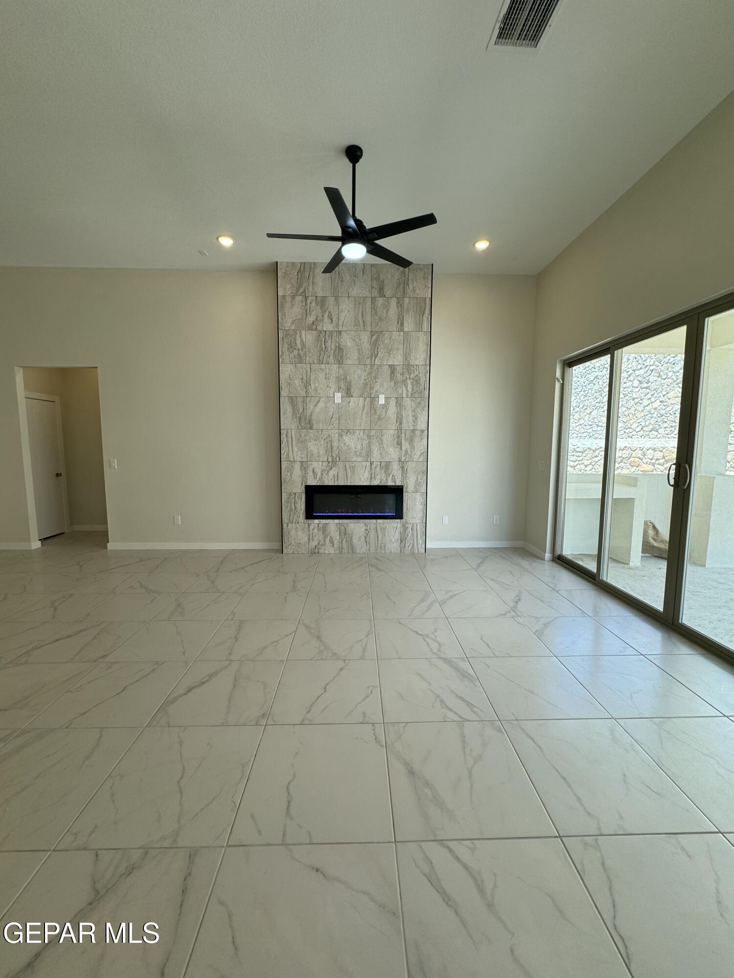 12237 Bahjat Drive El Paso, TX 79934 - Photo 5 of 25 a view of an empty room with a window