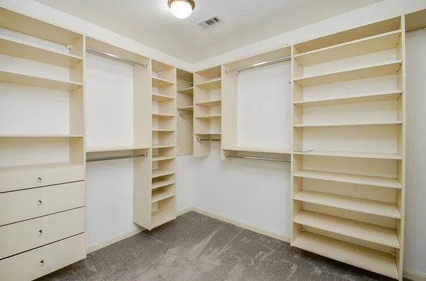 a view of an empty walk in closet