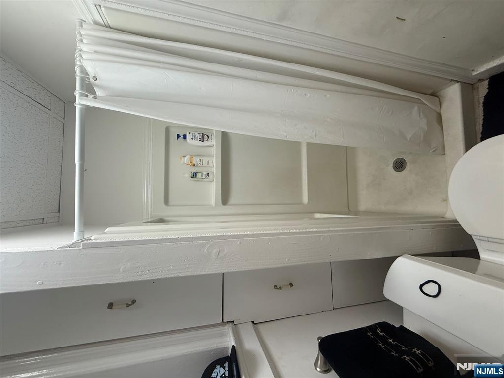 322 Anderson Avenue Fairview, NJ 07022 - Photo 6 of 13 a bathroom with a shower and toilet