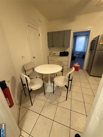 a kitchen with stainless steel appliances a stove refrigerator sink and cabinets