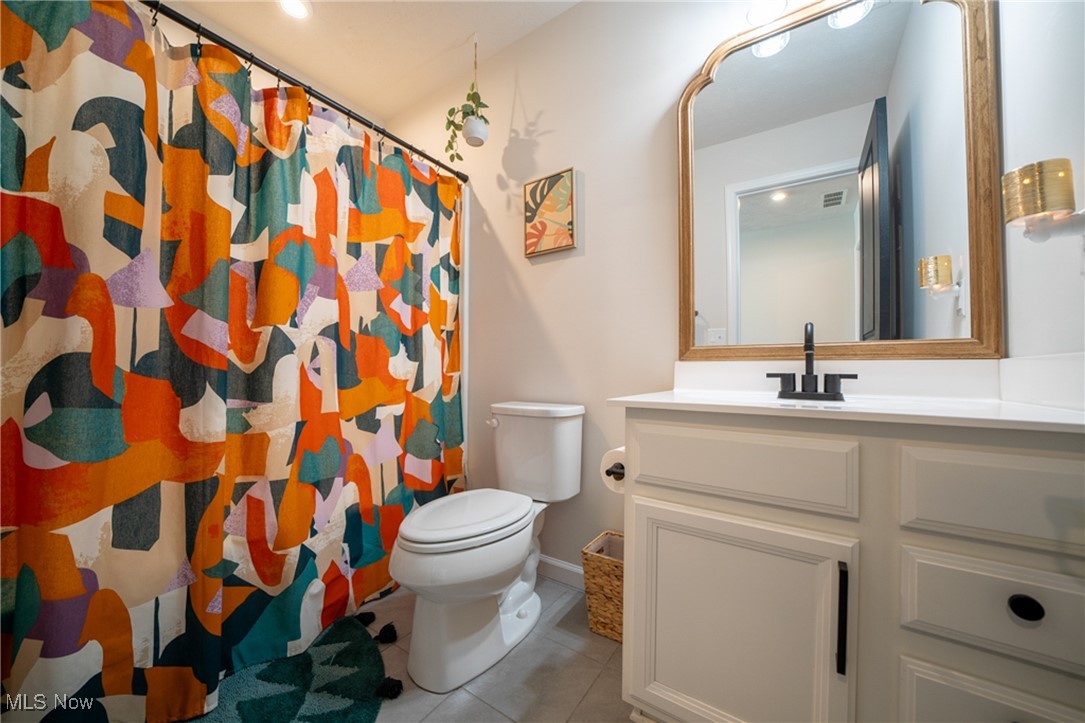 270 Stone Ridge Way Berea, OH 44017 - Photo 21 of 30 Bathroom with vanity, toilet, a shower with curtain, and tile patterned flooring