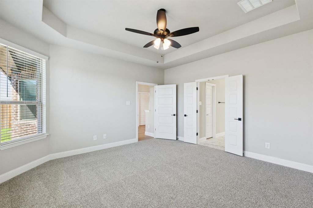 1366 Chisos Way Forney, TX 75126 - Photo 17 of 38 a view of an empty room with a ceiling fan