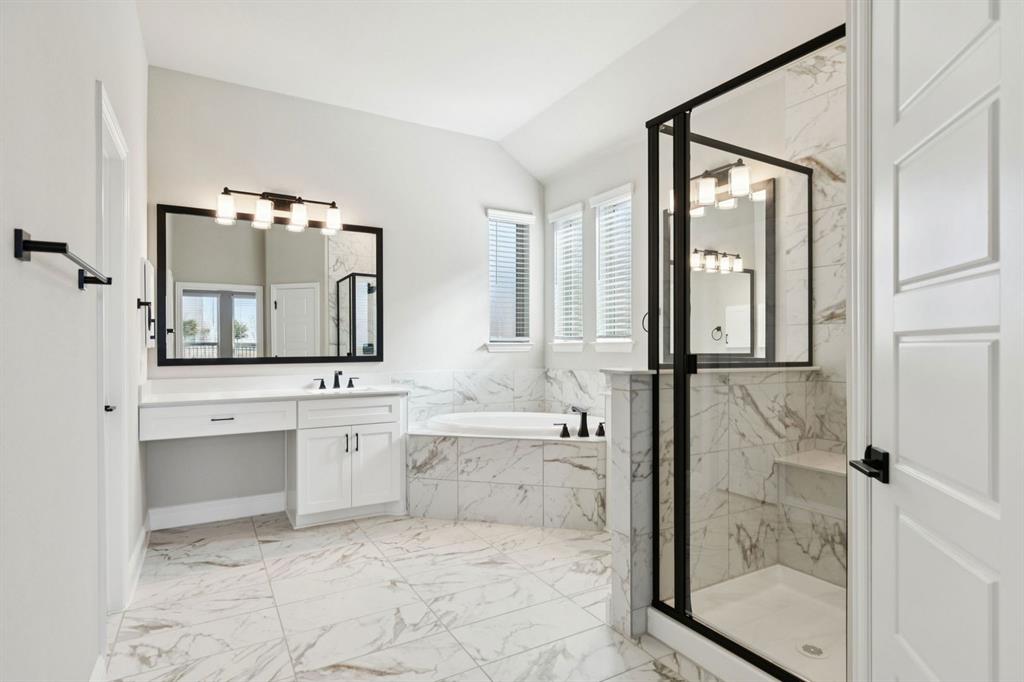 1366 Chisos Way Forney, TX 75126 - Photo 19 of 38 a bathroom with a granite countertop sink mirror and bathtub