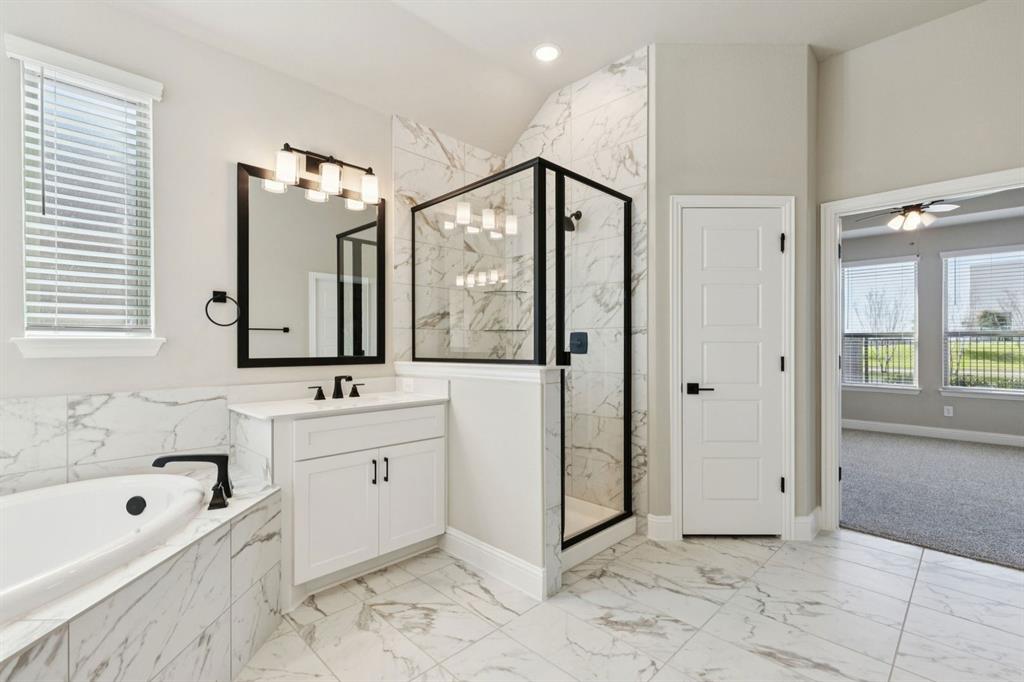 1366 Chisos Way Forney, TX 75126 - Photo 20 of 38 a spacious bathroom with a tub sink and mirror
